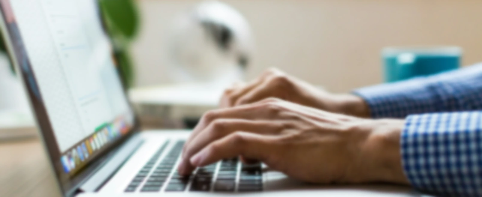 person typing on silver MacBook
